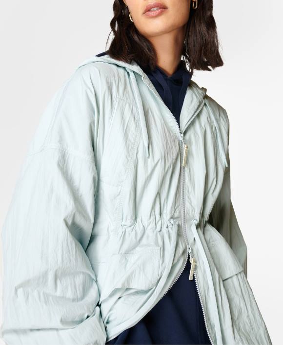 ropa azul celeste T28T834 parka corta de caída libre mujer Sweaty Betty